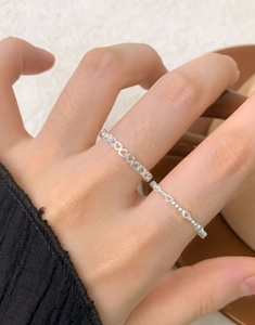 Detail shot of S925 sterling silver hollow heart rings with minimalist beaded design