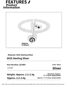 Macro shot of S925 sterling silver musical note ring with black spiral star details