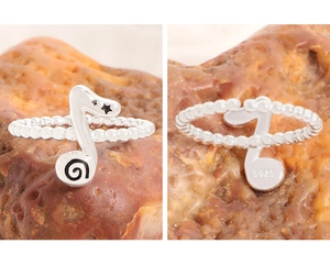 Detailed S925 sterling silver music note ring showing beaded band and material stamp