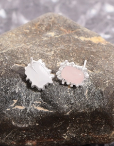 Macro detail of S925 sterling silver hallmark on geometric pink crystal stud earring