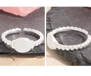 Detail view of adjustable S925 sterling silver twist ring with S925 hallmark stamp