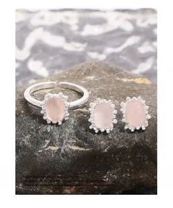 Detailed macro view of S925 sterling silver pink quartz ring and stud earrings set