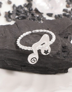 Detail of S925 silver music note ring featuring twist band and black star patterns