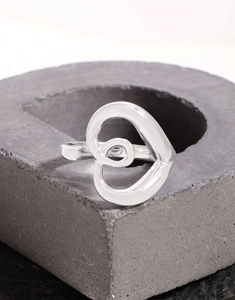 Detailed view of S925 sterling silver hollow heart ring with spiral pattern on stone