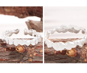 Detail view of S925 sterling silver stamp on irregular heart shaped open ring