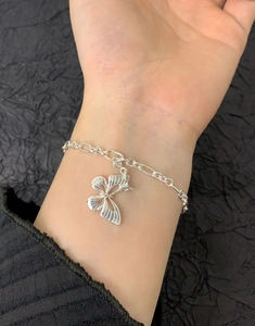Close-up of S925 sterling silver ball chain bracelet with hollow butterfly pendant detail
