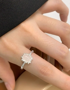 Detailed view of an S925 silver ring featuring a pink rectangular crystal and beaded edge