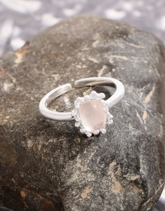 Macro shot of pink quartz ring with zircon halo and adjustable S925 silver band