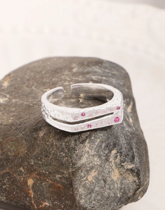 Detail of S925 sterling silver ring with double-layer texture and pink zircon stones