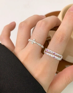 Close-up of double-layer S925 silver rings with zircon and red gemstones on hand