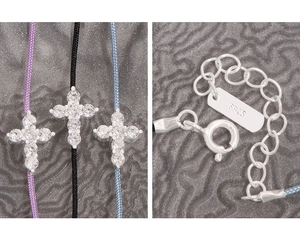 Detail of S925 sterling silver cross charm bracelet with cubic zirconia and adjustable clasp