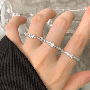 Three-piece S925 sterling silver ring set with zircon accents and textured band designs