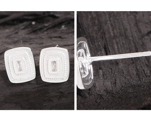 Detailed close-up of S925 hallmark on silver geometric square stud earrings with zircons