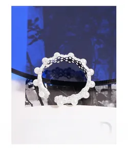 Detail view of adjustable S925 sterling silver ring with multiple inlaid white pearls