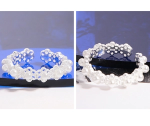 Detailed macro view of S925 sterling silver lace flower ring with elegant white pearls