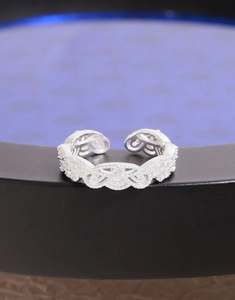 Macro detail of S925 sterling silver lace crown ring with shimmering zircon inlays