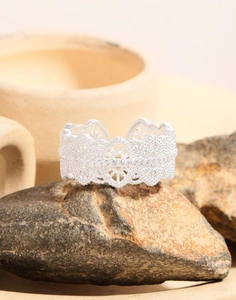 Detailed macro view of vintage lace-style S925 silver ring with zircon inlays