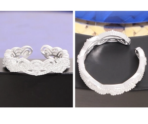 Macro view of S925 sterling silver crown ring showing lace pattern and metal hallmark