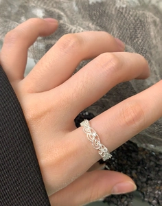 Close-up of S925 sterling silver lace crown ring with zircon on female finger