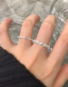 Detailed view of S925 sterling silver textured ring set with micro-inlaid zircons