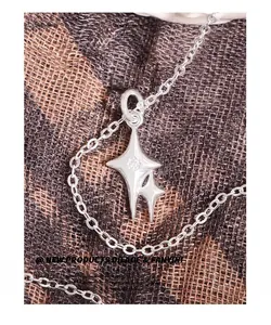Close-up of S925 sterling silver double star pendant necklace with cubic zirconia