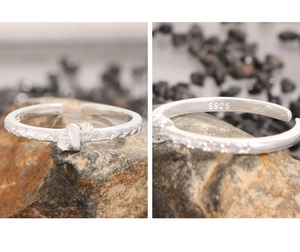 Detail view of S925 sterling silver ring showing star patterns and S925 hallmark stamp