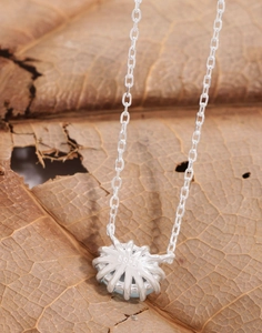Close-up of S925 sterling silver hallmark on the back of oval aquamarine stone pendant
