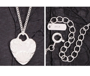 Detailed view of S925 sterling silver heart pendant with delicate shell and plant motifs