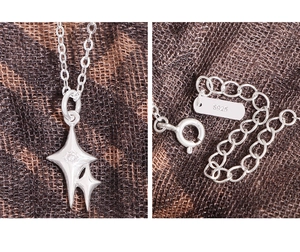 Macro shot of S925 sterling silver star pendant with cubic zirconia and clasp details