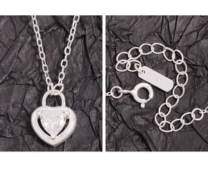 Close-up of S925 sterling silver heart zircon necklace with lobster clasp and chain detail