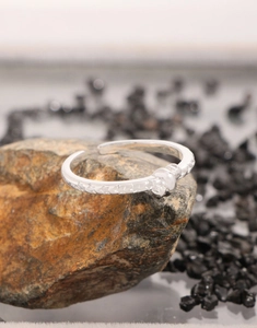 Detailed macro view of S925 sterling silver open ring featuring embossed star patterns