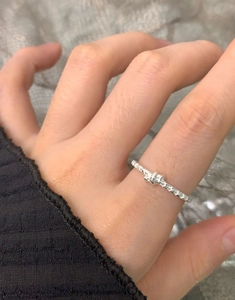 Detailed view of S925 sterling silver star ring featuring a delicate wave texture