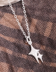 Detailed close-up of S925 silver double star pendant necklace with sparkling zircon stone