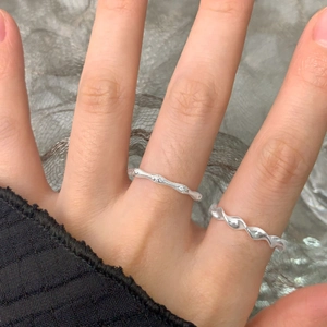 S925 sterling silver textured branch ring and twisted wave band shown on hand