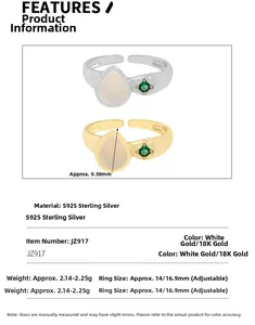 Detail view of pear-shaped agate and small green diamond on adjustable S925 silver rings