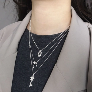 Three-layer silver necklace with heart, bow, and key pendants for women neck styling