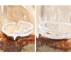 Détail macro du poinçon en argent S925 et bague étoile scintillante avec zircon
