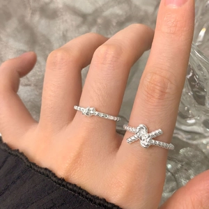 S925 sterling silver star and knot open rings set with vintage texture on a plush surface