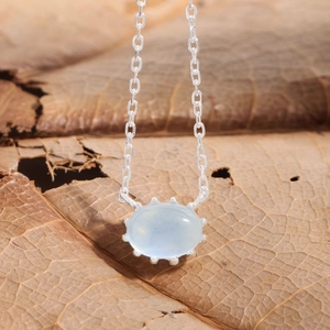 Elegant S925 sterling silver necklace featuring an oval natural aquamarine pendant on a leaf