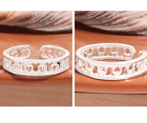 Detail shot of heart-shaped hollow ring showing the S925 sterling silver stamp