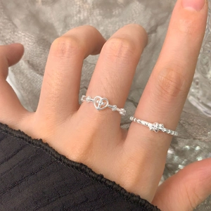 Minimalist S925 sterling silver star and heart cross rings worn in a stackable style