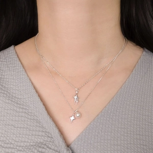 Double-layered S925 silver necklace with sparkling star pendants and a white pearl accent