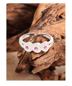 Close-up of S925 silver ring featuring three heart-shaped pink stone settings