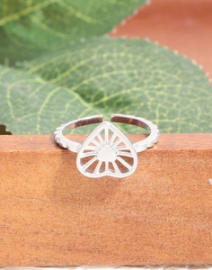 Macro detail of S925 sterling silver open ring featuring a hollow heart and sunburst pattern