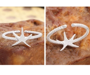 Vue macro de la bague étoile de mer en argent S925 avec anneau torsadé et poinçon