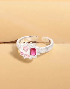 Close-up of S925 sterling silver cloud ring featuring pink zircons and lava texture