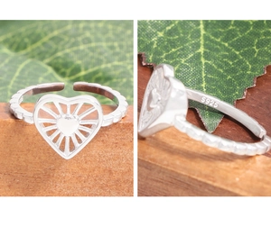 Detailed view of S925 sterling silver stamp on the inner band of the heart ring