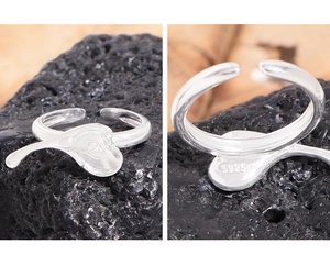 Close-up of S925 hallmark on irregular silver heart ring with adjustable open design