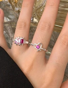 Close-up of S925 silver lava texture rings with pink heart and red zircon stones