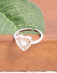 Close-up of S925 silver stamp on heart-shaped adjustable ring with beaded texture
